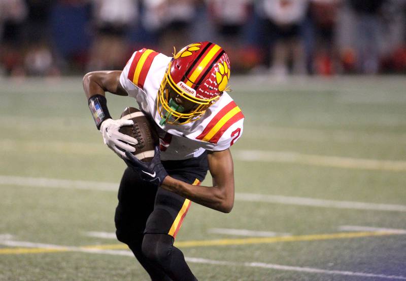 Batavia’s Isaiah Brown catches a pass from quarterback Ryan Boe during a game at Geneva on Friday, Sept. 29, 2023.