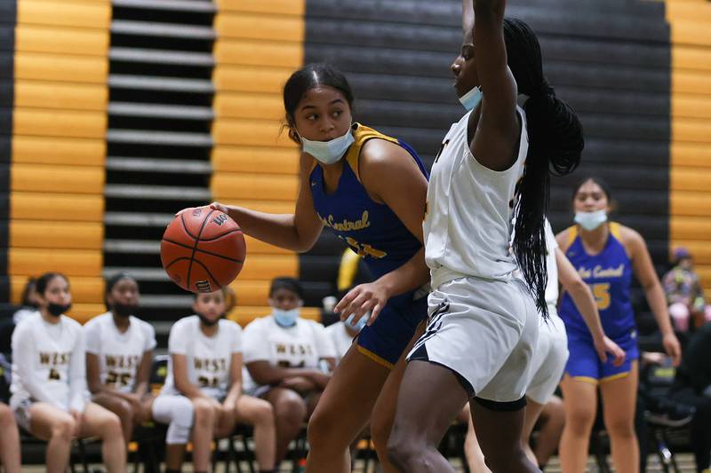 Joliet Central’s Kiyah Davis looks for a play against Joliet West in the Class 4A Moline Regional semifinal. Tuesday, Feb. 15, 2022, in Joliet.