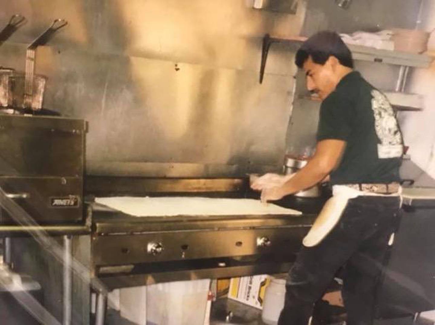 Raul Briseno Sr. makes one of his famous 6-foot burritos at Raul's Burrito Express in Wauconda in this 1996 photo, when Briseno was 31. The restaurant's slogan was "Home of the 6-foot burrito," which Briseno would make for parties. It was Briseno's first restaurant.