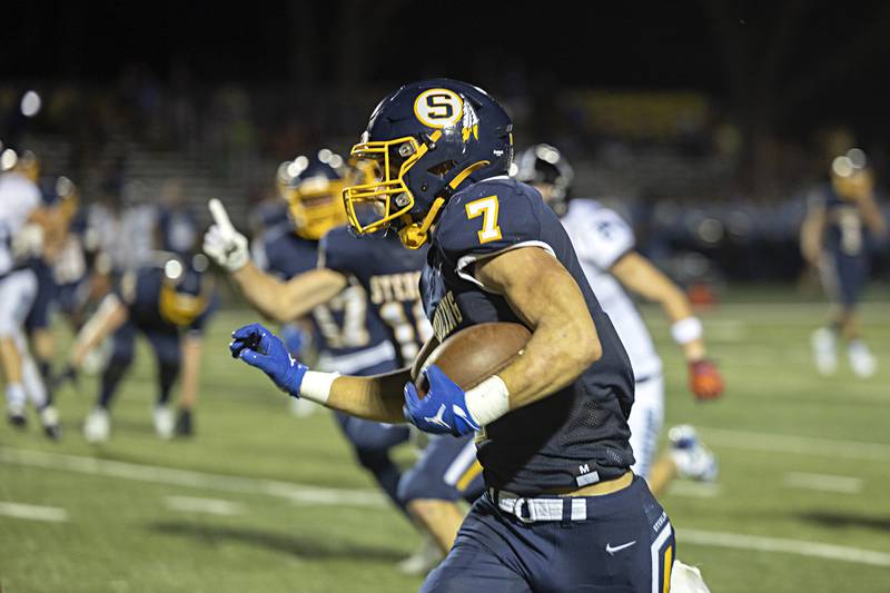 Sterling’s Andre Klaver picks up big yards to put the Warriors in the red zone against St. Francis Friday, Sept. 1, 2023 at Sterling High School.