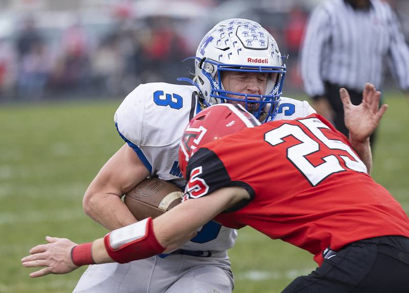 Martinsville’s Adam Parcel is hit by Amboy’s Brayden Klein Saturday, Nov. 9, 2024, in round two of the 8-man football playoffs.