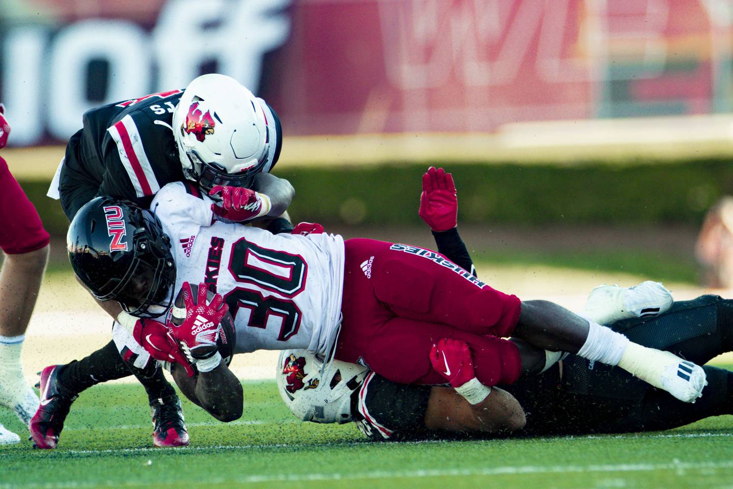 NIU running back Harrison Waylee is brought down at the end of a run against Ball State on Saturday, October 1, 2022