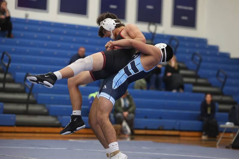 Plainfield South’s Damien Angniano throws Plainfield North’s Lucas Frydrychowski in a Southwest Prairie dual meet on Wednesday, Nov. 29, 2023 in Plainfield.