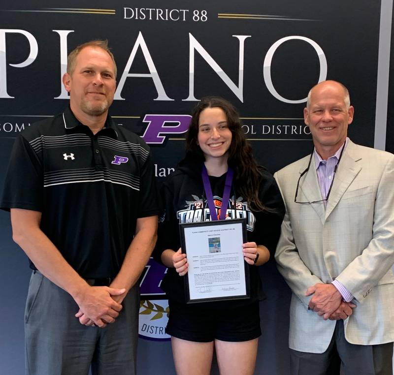 Pictured from left are Plano School District Superintendent Tony Baker, PHS junior Sasha Helfgott-Waters and PHS head girls track coach Rick Ponx.