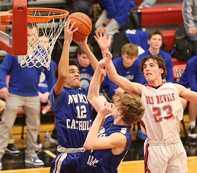 Newman's Isaiah Williams grabs a rebound over Hall's Domonic Galetti on Friday, Feb. 3, 2023 at Hall High School.
