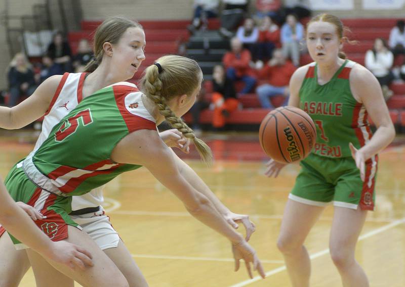 The Cavalier’s Addison Urbanski works a pass to team mate Addison Duttlinger Thursday during the 1st period at Ottawa.