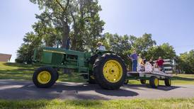 As requested, woman arrives at her final resting place on a hayrack