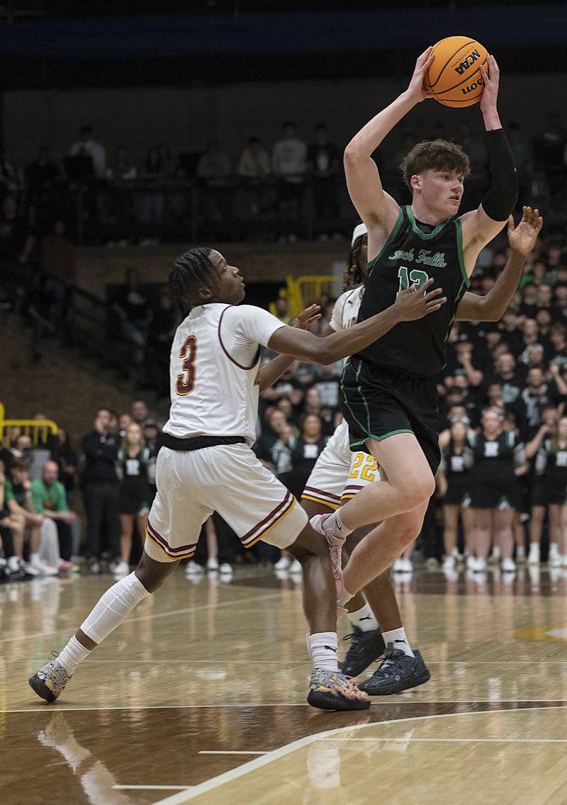 Rock Falls’ Ryken Howard looks to make a play against Christ the King’s Mike Thomas Monday, March 10, 2025, during the Class 2A boys basketball Supersectional in Sterling.
