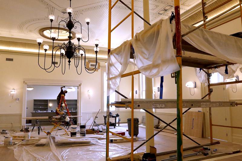 Finishing touches are done in the former courtroom of the he newly remodeled Old Courthouse Center in Woodstock on Thursday, July 13, 2023, during a tour of the building.