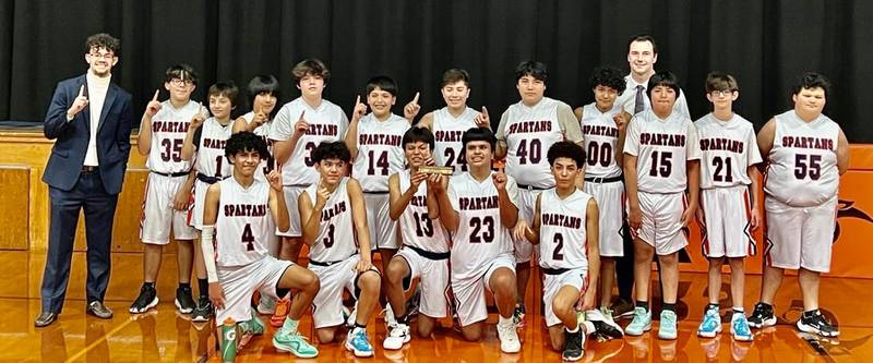 The DePue Spartans captured the BVEC tournament championship, defeating PCA 48-31 Thursday at Bradford. The Spartans improved to 20-1. Team members are (front row, from left to right) Diego Perez. Pedro Lopez. Nico Lopez. Enrique Lopez and Ricky Mata; (back row) Coach Makade Rios. Christian Rodriguez. Edward Rodriguez. Diego Alvarez-parra. Joel Mendez, Diego Madrigal. Javi Rosales. Fernando Sandoval. Jorge Trujillo. Christian Torres. Zach Yuvon, Ruben Avila and head coach Trae Blumhurst (back).