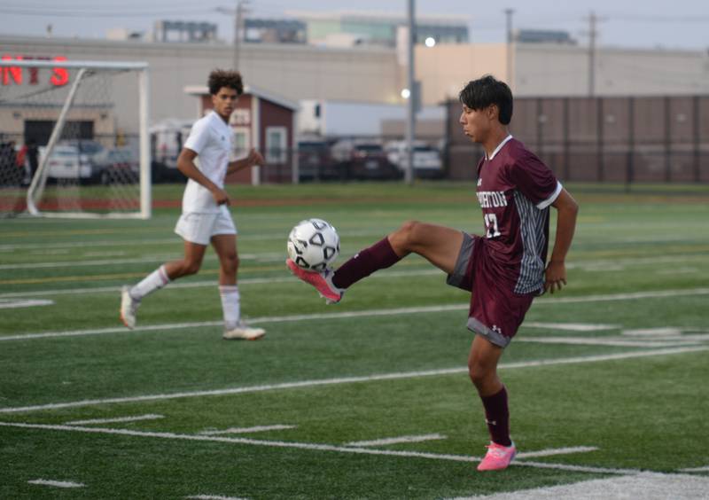 Morton West's Yahir Aguilar receives a pass during their home game against Naperville Central  Monday, Aug. 21, 2023.