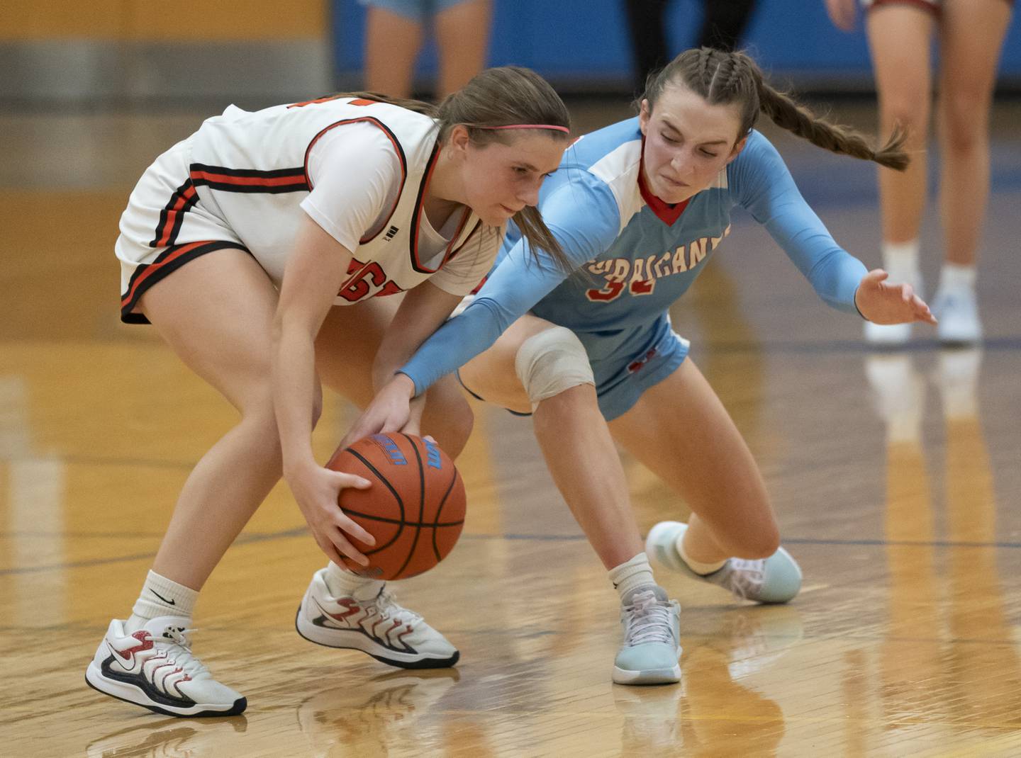 Crystal Lake Central's Katelyn Hallum, left, and Marian Central's Juliette Huff battle during their game at the Johnsburg High School Varisty Feast Mode Holiday Girls Basketball Tournament on Tuesday, November 19, 2024 in Johnsburg. Ryan Rayburn for Shaw Local