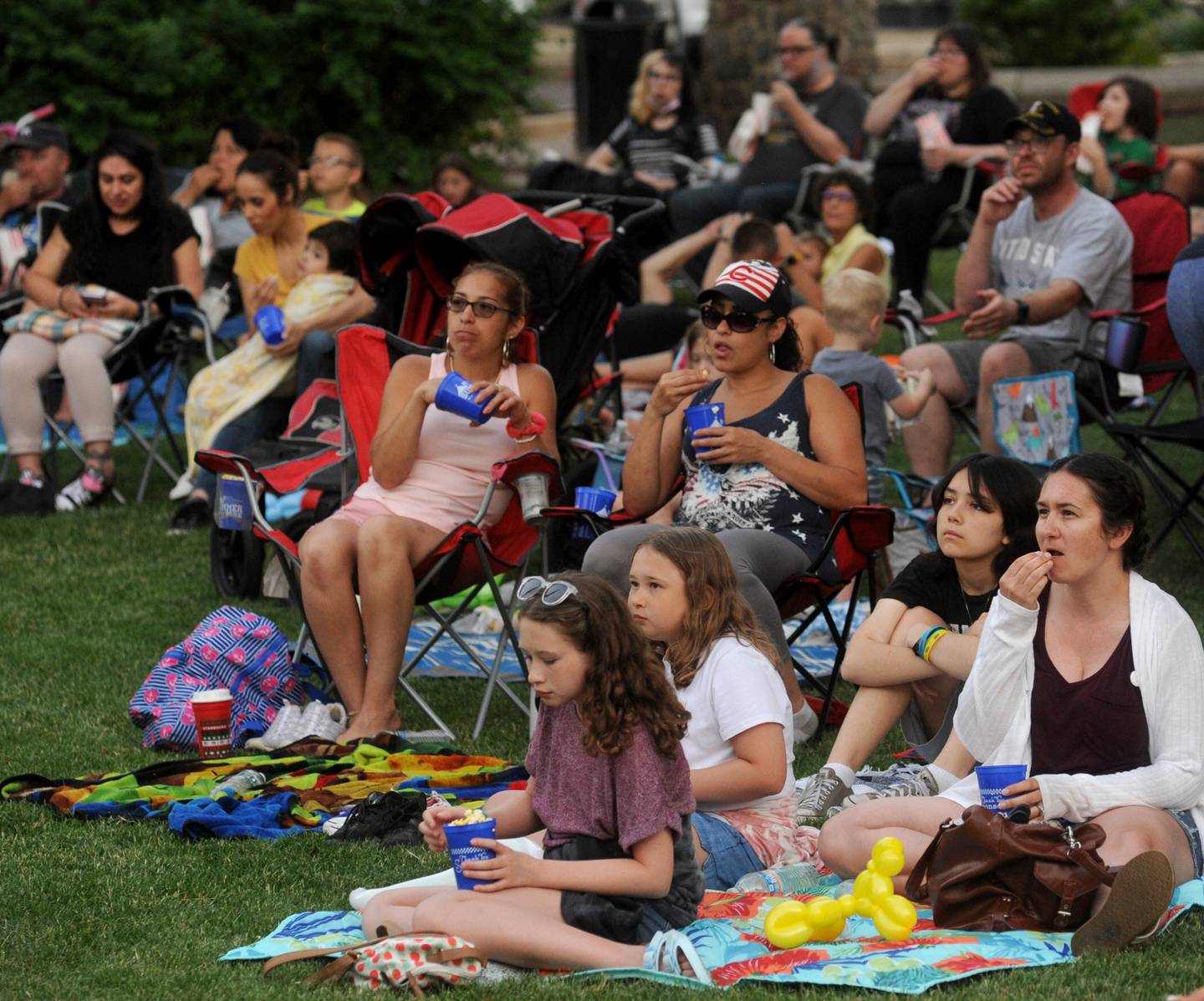 People enjoy watching “The Mitchells vs. The Machines” movie during Woodstock’s Summer in the Park Thursday June 23, 2022, in the historic Woodstock Square. The festivities that continue on Saturday, will move to the Woodstock Water Works, 1313 Kishwaukee Valley Road, for the Aqua Fiesta Party from 1 to 4 p.m. with a DJ, bags tournament and beer garden. Then come back to the Square on Sunday from noon to 4 p.m., for food, kids games, prizes, petting zoo, pony rides, bounce house, balloon creations, bingo, a Theatre 121 children’s show and Woodstock area nonprofit booths.