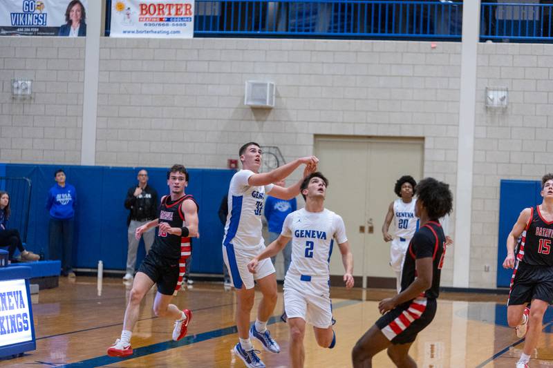 Geneva's Ben Peterson launches a shot from before half court at the buzzer for a three pointer to close the quarter against Batavia on Friday, Dec.19,2025 in Geneva.