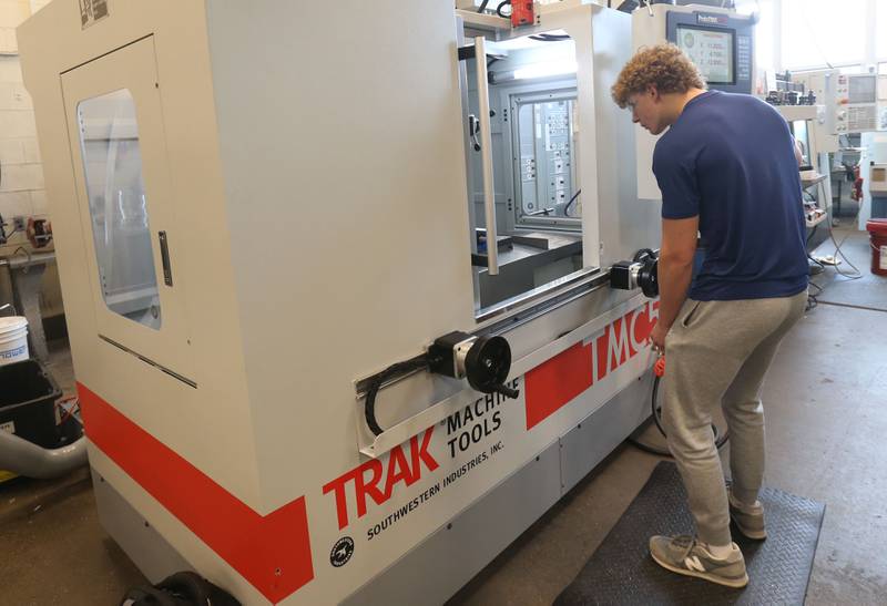 Area Career Center student Christian Konczak uses a TRAK TMC 5 milling machine designed for precision work in a toolroom environment, in the machine shop classroom on Tuesday, Feb. 11, 2025 at La Salle-Peru Township High School. The TRAK Machine Tools company donated two machines totaling $105,000 to the Area Career Center last fall. February is Career and Technical Education (CTE) month.  The month recognizes CTE programs and their contributions to preparing students for college and careers.