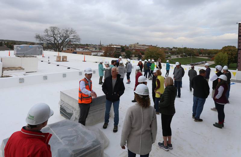 A large group of people gather on top of the rooftop of the new YMCA building on Thursday, Oct., 19, 2023 in Ottawa. The rooftop area can be used for special gatherings, events, gatherings parties and more.