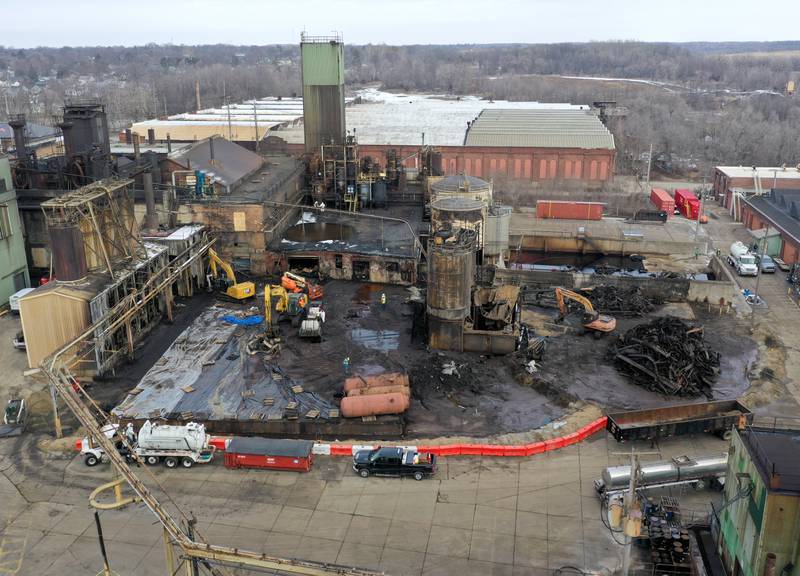 Excavators remove debris from the Carus Chemical fire at the plant on Tuesday, Jan. 24, 2023 in La Salle. A massive fire broke out on Jan. 11, 2023 at the facility. The fire resulted in a substance covering homes, cars, yards and outdoor items that appeared brown-orange, green or purple depending on its state. Carus Chemical and the EPA said the substance was an oxidant called potassium permanganate, which is corrosive, but is mostly non-harmful, unless it is in great concentration. The chemical is distributed by Carus to treat drinking water, among other applications.