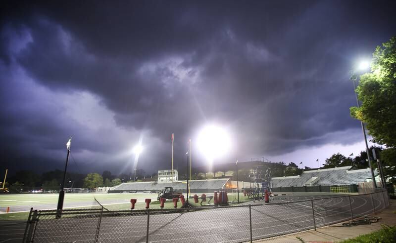 A severe thunderstorm moves in over on Friday, Aug. 25, 2023 at Tucci Stadium in Bloomington. St. Bede and Tuscola had a lightning delay for almost an hour while playing at Illinois Wesleyan University. The score was 19-12 with Tuscola at halttime.