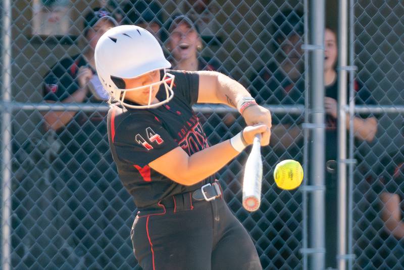 Yorkville's Sara Ebner (14) singles driving in a run against Plainfield North during the Class 4A Yorkville Regional softball final at Yorkville High School on Friday, May 26, 2023.