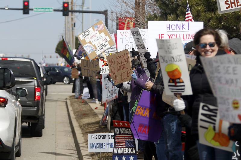 Protesters line State Route 31 near the intersection of McCullom Lake Road in McHenry to protest their discontent with President Donald Trump and his administration's policies on Saturday, March 28, 2026, during the McHenry County No Kings Protest. According to an organizer, over 4,000, people took part in the protest.