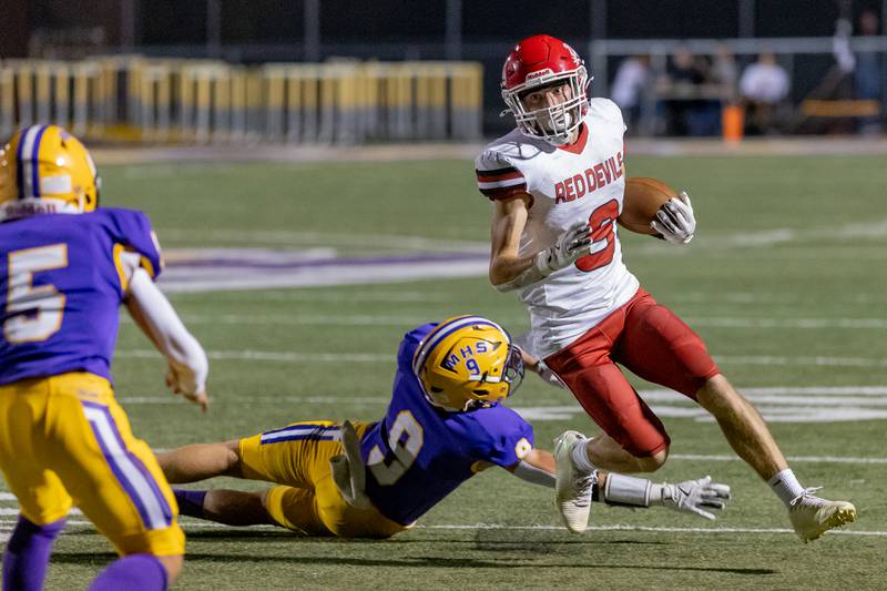 Hall High School's David Luna avoids the tackle attempt from Gavin Evans of Mendota during the game at The Jeff Prusator Athletic Complex on September 12, 2025 at Mendota High School.