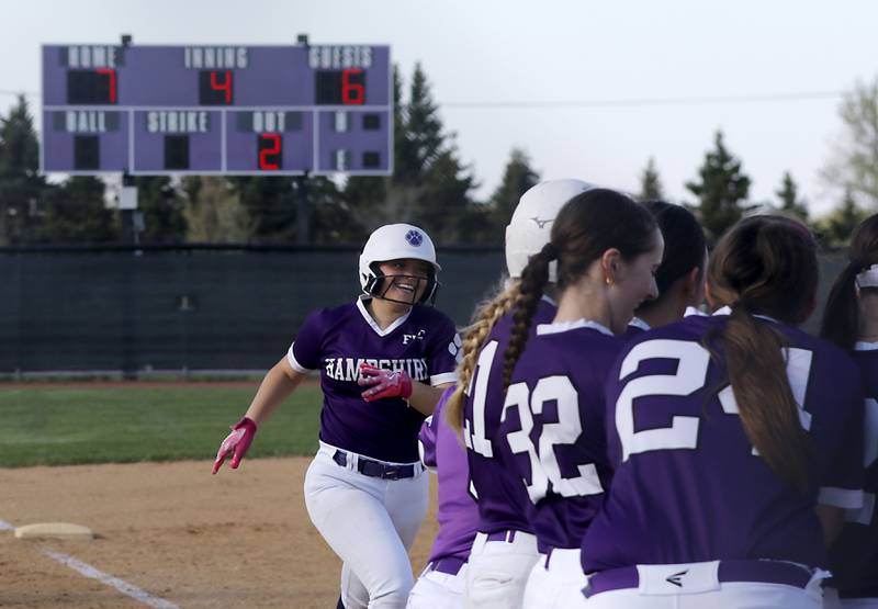 Hampshire's Addi Edlen smiles as she runs home after hitting a home run during a Fox Valley Conference softball game against Burlington Central on Tuesday, April 21, 2026, at Hampshire High School.