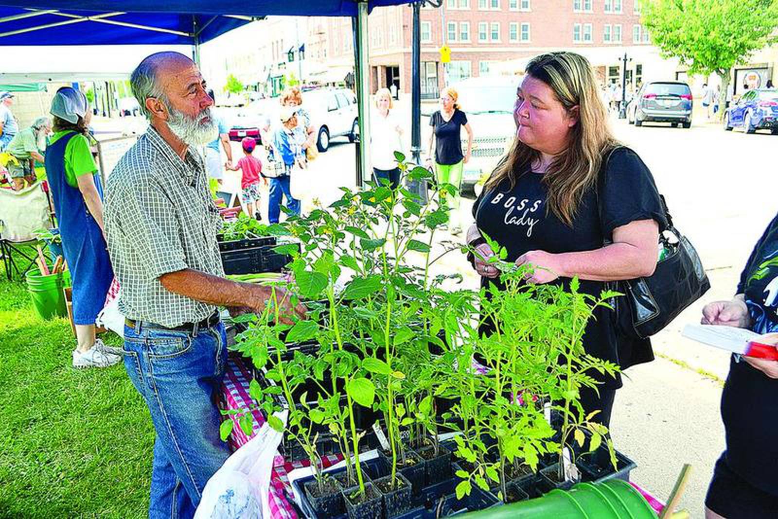 Making a purchase at the Princeton Farmers’ Market Shaw Local