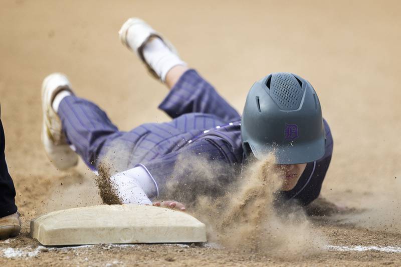 Dixon’s Bryce Feit dives back to first against Rock Falls Monday, April 22, 2024 in Dixon.