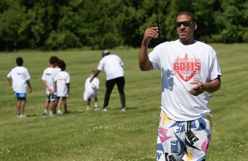 John Walker watches over the inaugural Legends of the 60115 Football Camp he set up with NIUÕs Cole Tucker as part of his Youth Pride Foundation on Sunday, June 26, 2022.