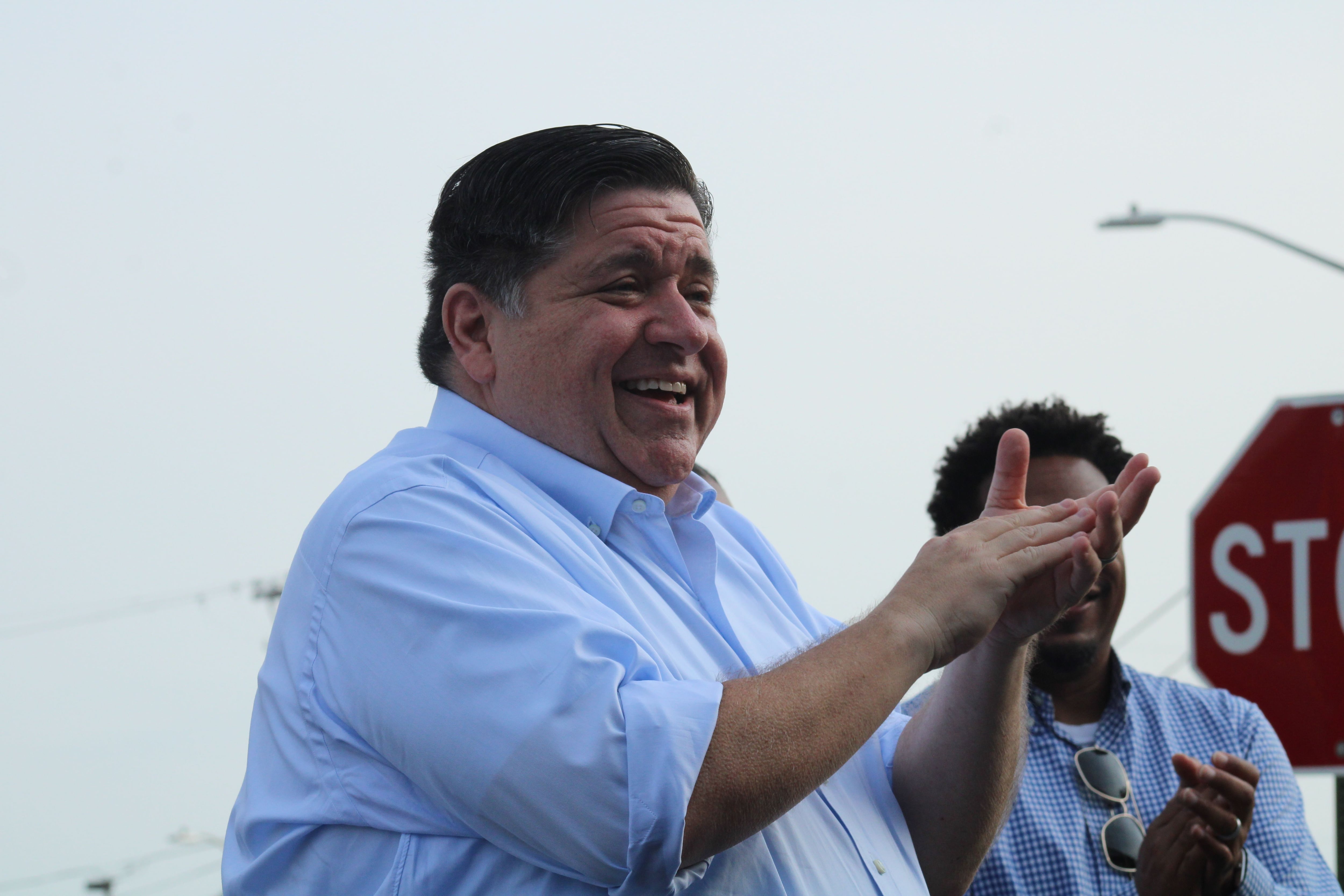 Gov. JB Pritzker greets Whiteside County Democrats gathered during a campaign stop on Sunday in Rock Falls.