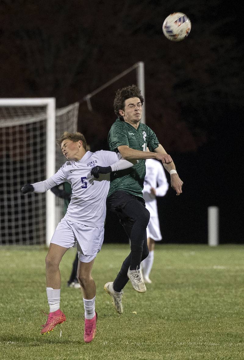 Dixon’s Nolan Valk and Geneseo’s Cedric Kehoe play the ball Wednesday, Oct. 23, 2024, during the class 2A soccer regional in Geneseo.