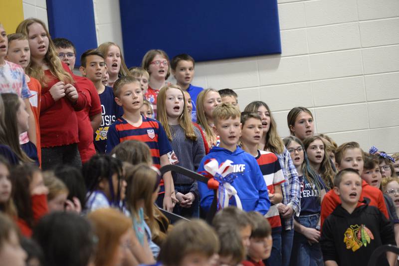 Centennial Elementary School fifth graders sing a patriotic song during the school's Veteran's Day program on Friday, Nov. 10, 2023 in Polo. The event also included a speech by a Polo veteran and a slideshow highlighting veterans who are related to school students.