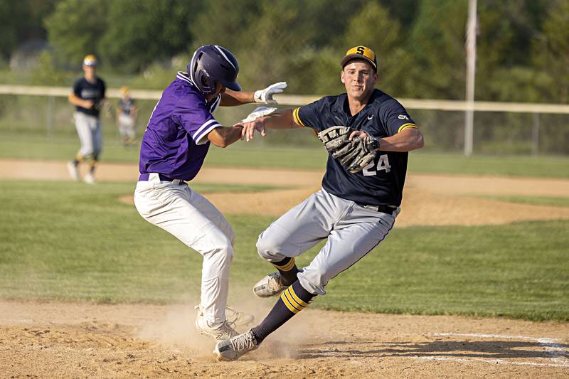 Rochelle’s Aidan Rodriguez collides with Sterling’s Braden Hartman covering the plate in class 3A regional action on Monday, May 22, 2023.