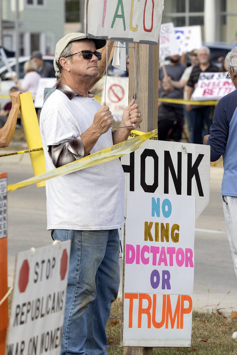 Signs show the protesters' disdain for President Trump on Saturday, Oct. 18, 2025, during a "No Kings" rally in Sterling.