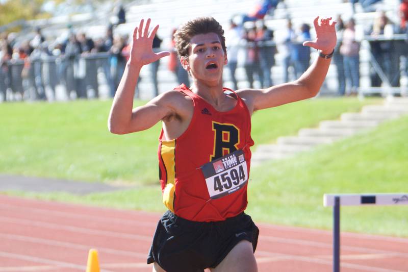 Batavia's Quintin Lowe celebrates his time at the DuKane Conference Cross Country Meet on Saturday, Oct, 15, 2022 in Roselle.