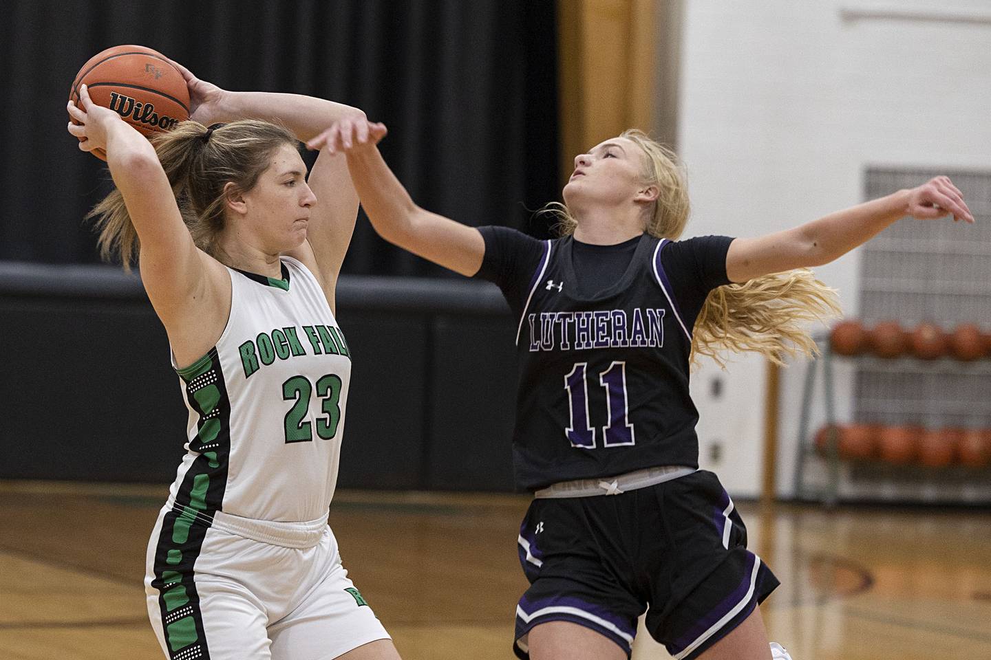 Rock Falls’ Claire Bickett looks to pass while being guarded by Rockford Lutheran’s Sydney Carlson Friday, Jan. 27, 2023.