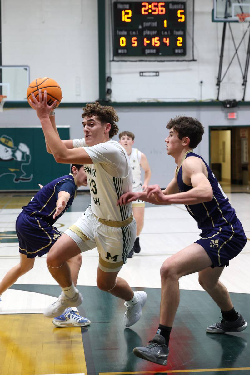 Bishop McNamara's Karter Krutsinger drives to the basket during the Fightin' Irish's 62-25 victory over Chesterton Academy on Wednesday, Jan. 7, 2026.