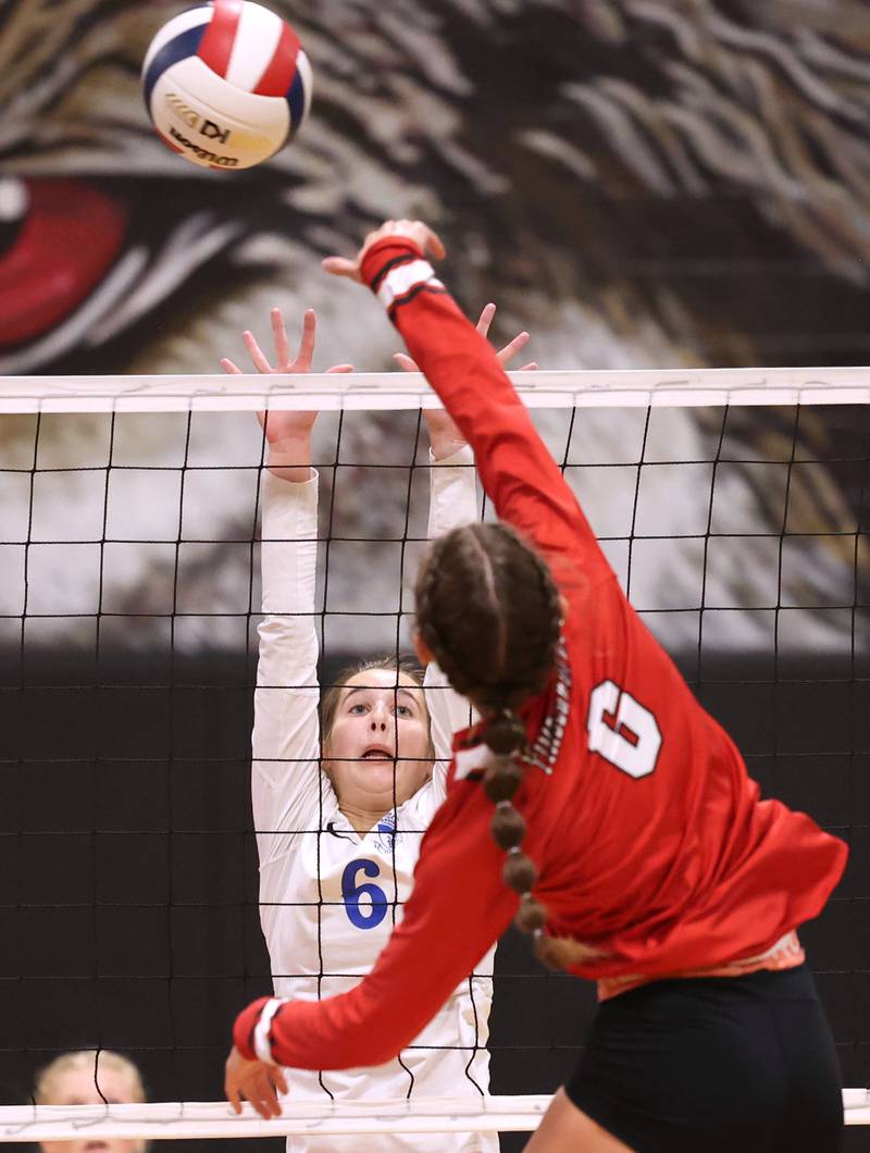 Hinckley-Big Rock's Courtlyn Brockway tries to block Indian Creek's Isabella Turner during their match Tuesday, Sept. 19, 2023, at Indian Creek High School in Shabbona.
