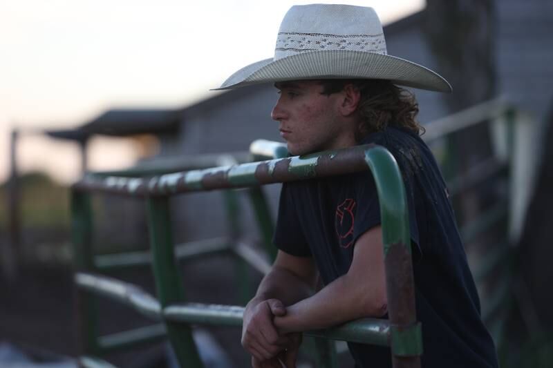 Dominic Dubberstine-Ellerbrock leans on a fence after practice. Dominic will be competing in the 2022 National High School Finals Rodeo Bull Riding event on July 17th through the 23rd in Wyoming. Thursday, June 30, 2022 in Grand Ridge.