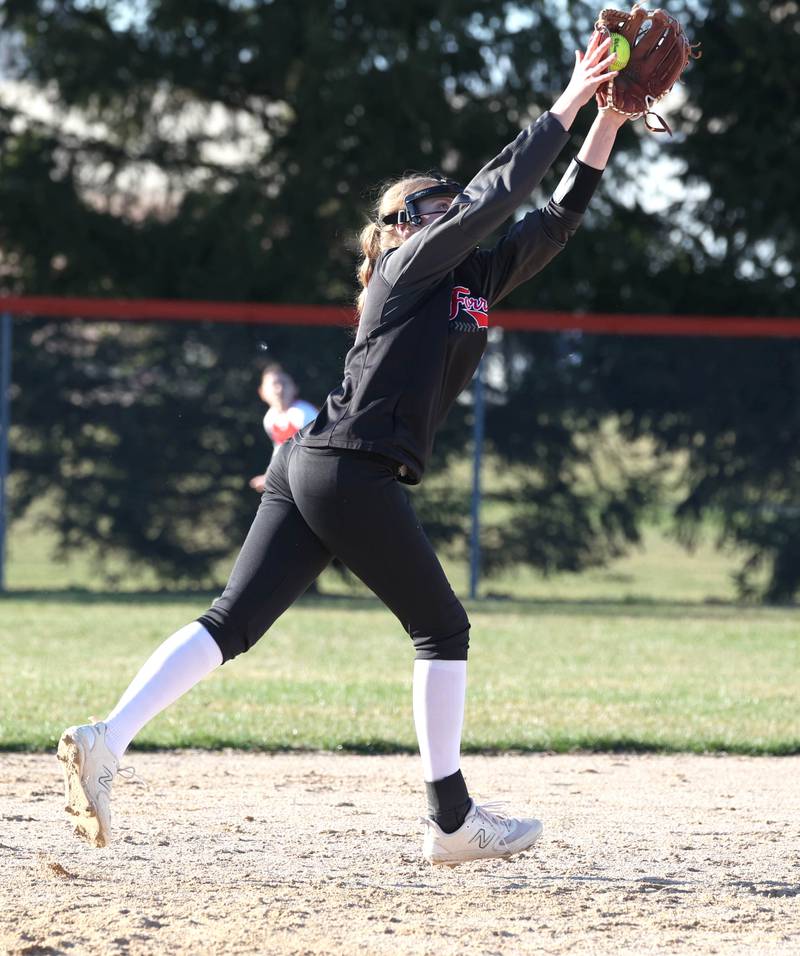 Forreston’s Jenna Greenfield grabs a line drive during their game against Genoa-Kingston Friday, March 15, 2024, at Genoa-Kingston High School.