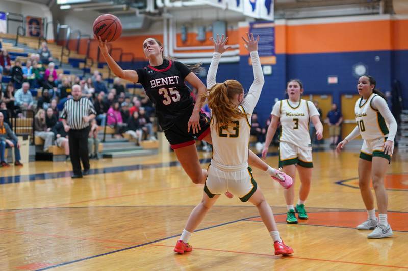 Benet’s Emilia Sularski (35) shoots the ball in the post against Waubonsie Valley's Lily Newton (23) during a Class 4A Oswego Sectional final basketball game at Oswego High School on Thursday, Feb 22, 2024.
