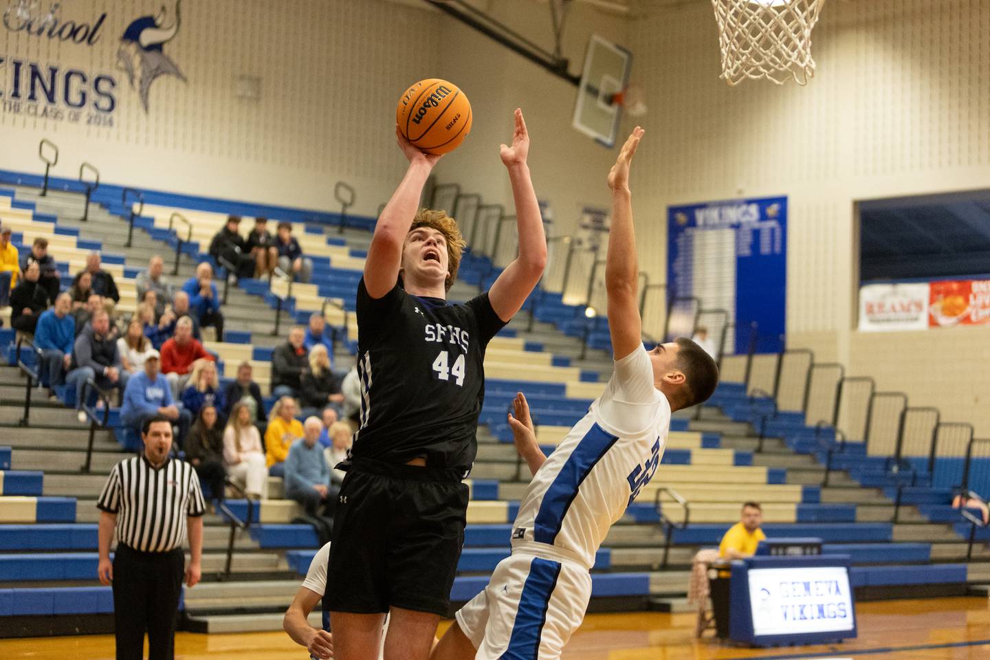 St. Francis's Ben Whorlow puts a shot up over Geneva's Ben Peterson at the 3rd Annual Bob Schick Thanksgiving Tournament on Friday, Nov.28,2025 in Geneva.