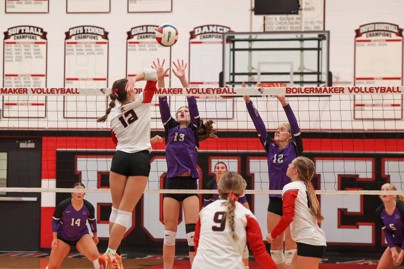 Manteno's Olivia McElroy, center, and Maddy Belisle jump to block a hit by Bradley-Bourbonnais' Ella Haas during the Panthers' victory in three sets, 25-21, 23-25, 25-17, over the Boilermakers on Monday, Sept. 15, 2025.