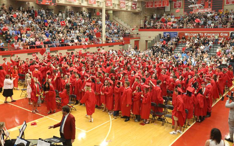 Ottawa High School class of 2026 graduates throw caps in the air after graduating during the commencement ceremony in Kingman Gymnasium on Friday, May 22, 2026 at Ottawa High School