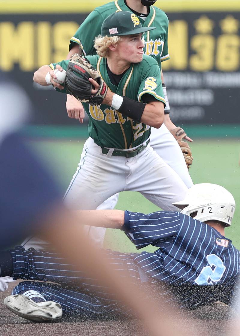 Crystal Lake South's Dayton Murphy tries to turn a double play as Nazareth's Josiah (Luke) Brabham tries to break it up Friday, June 10, 2022, during their IHSA Class 3A state semifinal game at Duly Health and Care Field in Joliet.