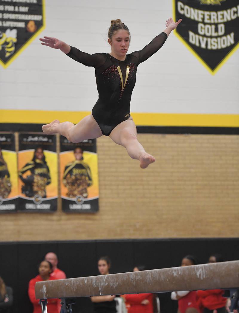 Batavia's Talia Gallas on the balance beam at the Hinsdale South girls gymnastics sectional meet in Darien on Tuesday, February 7, 2023.