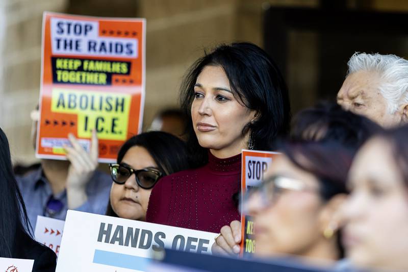 Azteca de Oro Banquet Manager Ivette Nunez listens to speakers during  a press conference held to uplift immigrant families and denounce the presence of the Texas National Guard in Will County at Azteca de Oro in Joliet on Oct. 8, 2025.