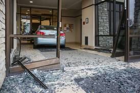 Woman crashes car into Harvard bank, suffers minor injuries: officials