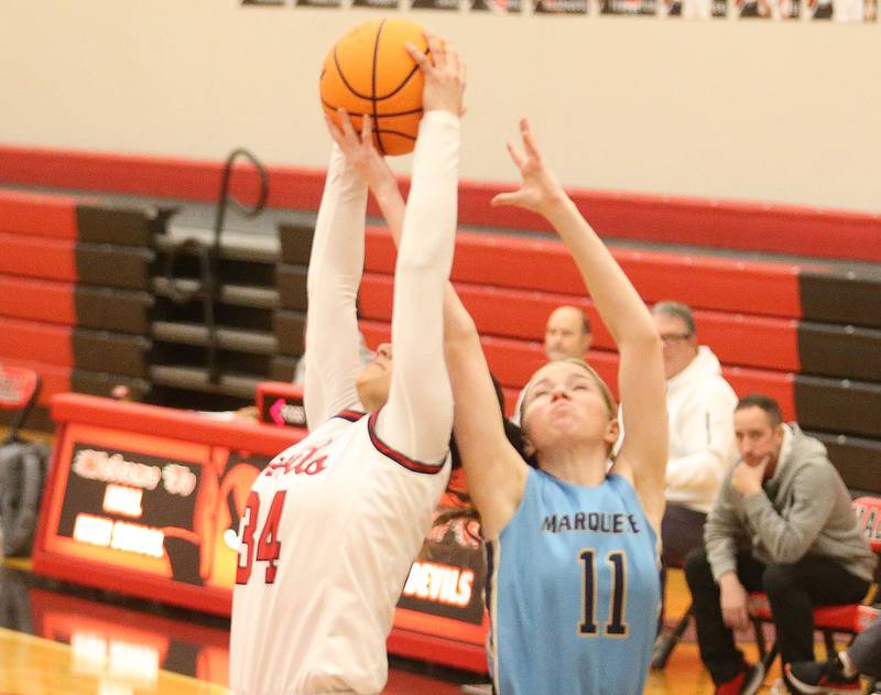 Hall's Natalia Zamora grabs a rebound over Marquette's Keely Nelson on Thursday, Feb. 13, 2025 at Hall High School.
