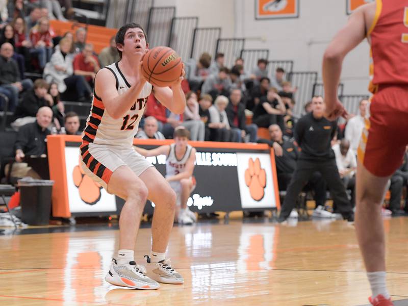 Wheaton-Warrenville South's Zach Rogers (12) takes a shot against Batavia during a game in Wheaton on Saturday, January 6, 2024.